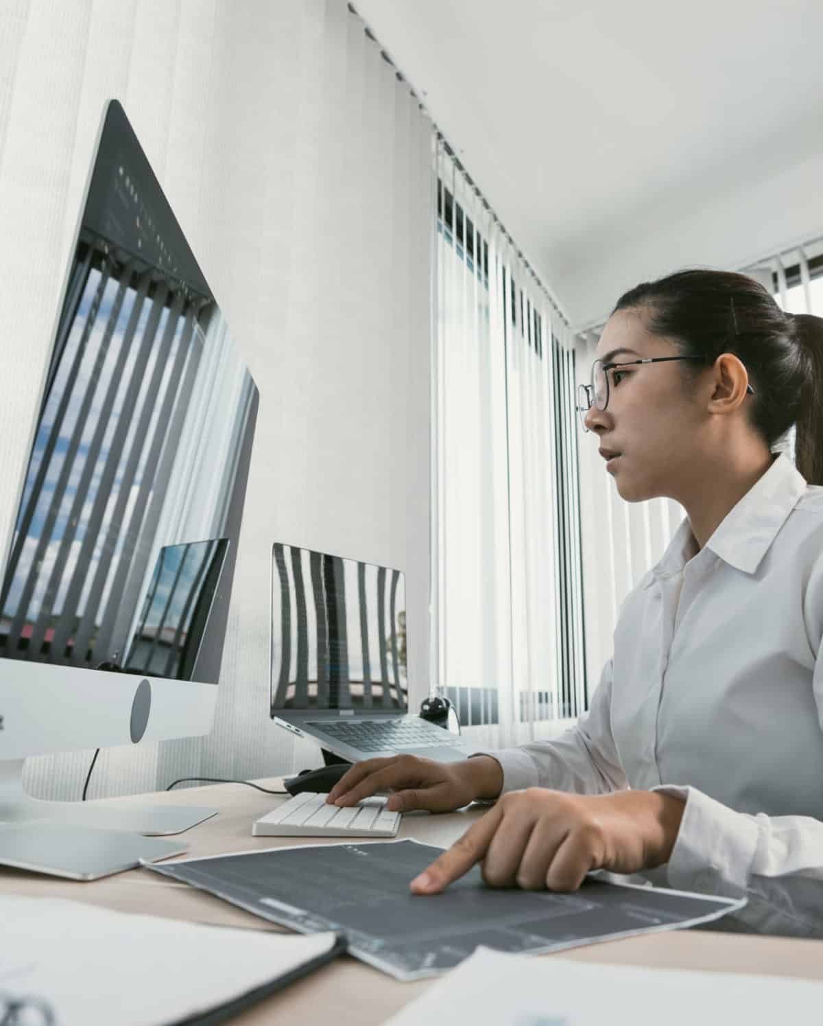 Woman asian software developers are analyzing together about the